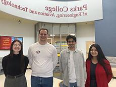 Afrida Atiar, Akbar Fidahussain, Davis Johnston and Elizabeth Redle posed in McDonnell Douglas Hall